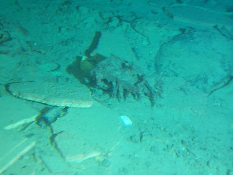  on ocean floor 2.35 miles below Atlantic -- lots of material from wreck scattered widely