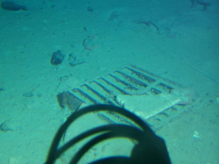  on ocean floor 2.35 miles below Atlantic -- lots of material from wreck scattered widely