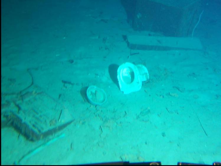  on ocean floor 2.35 miles below Atlantic -- lots of material from wreck scattered widely