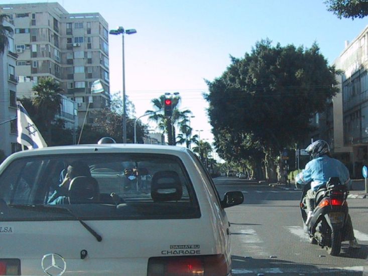 Tel-Aviv traffic - motorcycles generally stop on pedestrian crossings